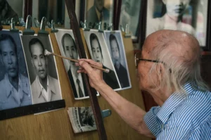 artisan hanoï qui retouche des photos